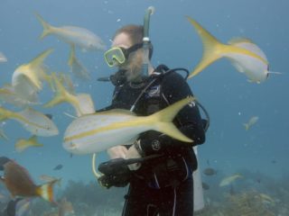 rob carter underwater with fish