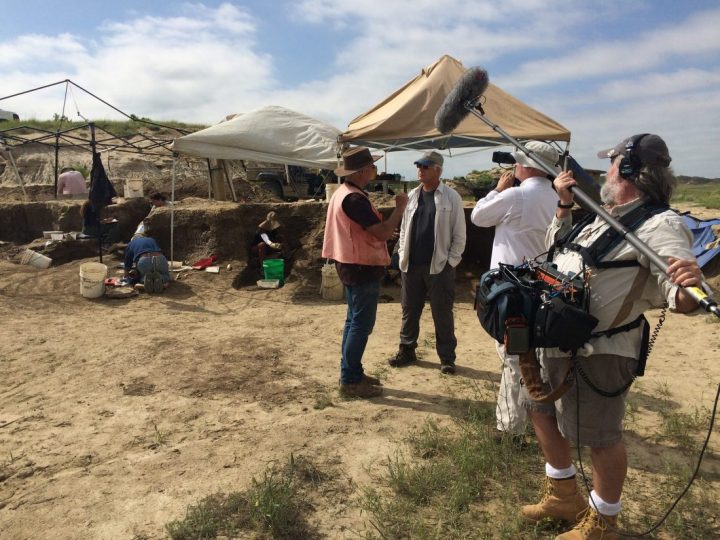 Art Chadwick and Del Tackett talking at a dig site